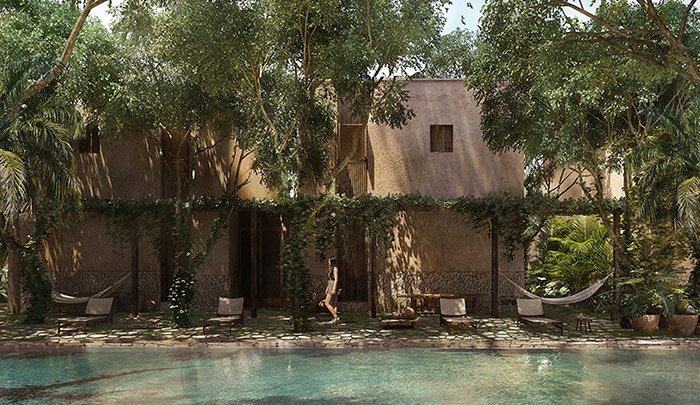 Piscina común con vegetación en Kokoon Pueblo